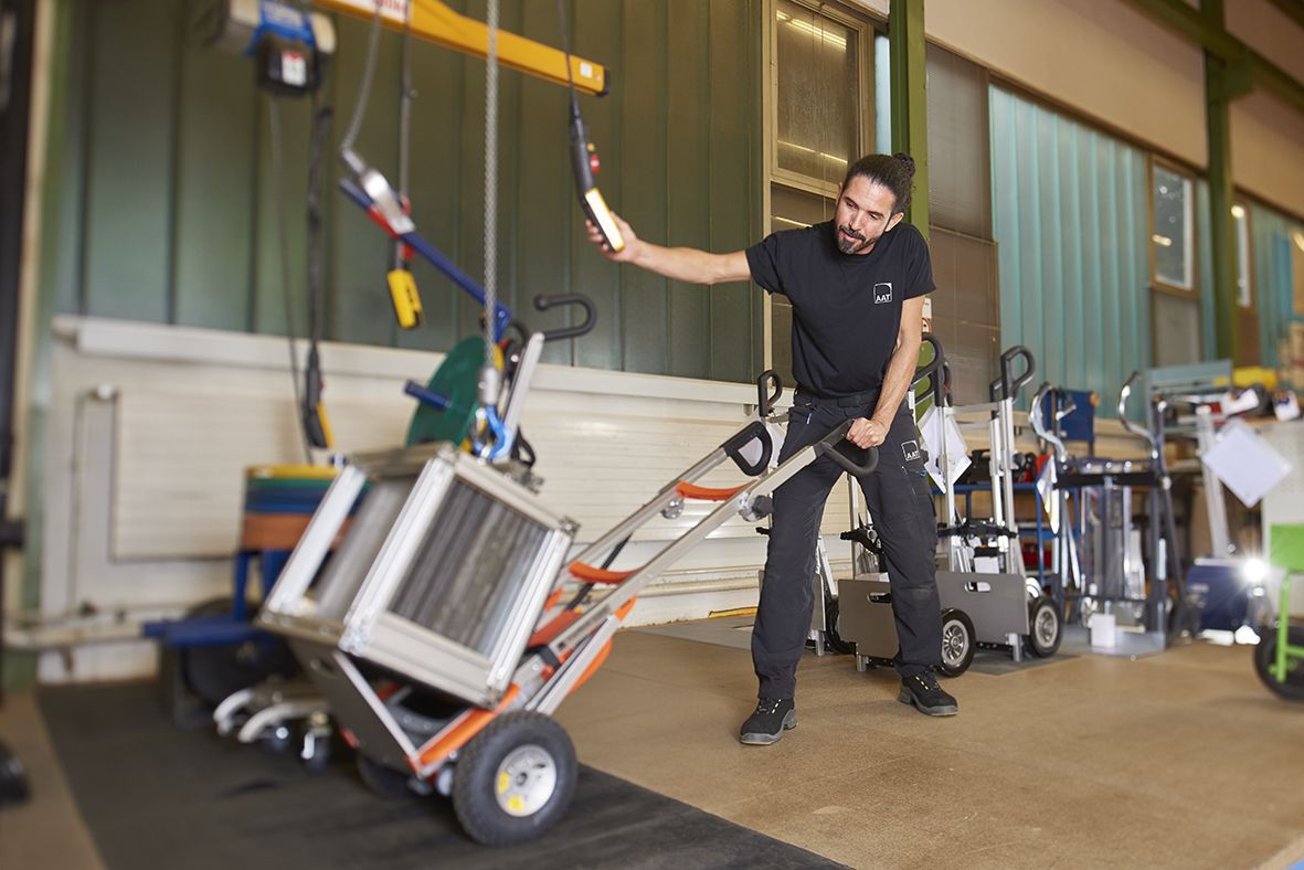 An employee of AAT tests a CargoMaster stair climber under maximum weight in the company's own final inspection. 