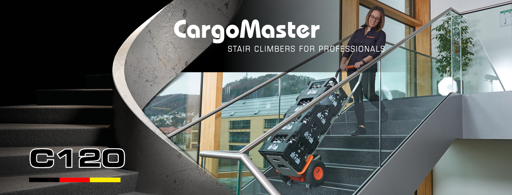 The picture shows a middle-aged woman effortlessly transporting several crates of drinks up a stairwell with the help of a CargoMaster C120 stair climber from AAT.